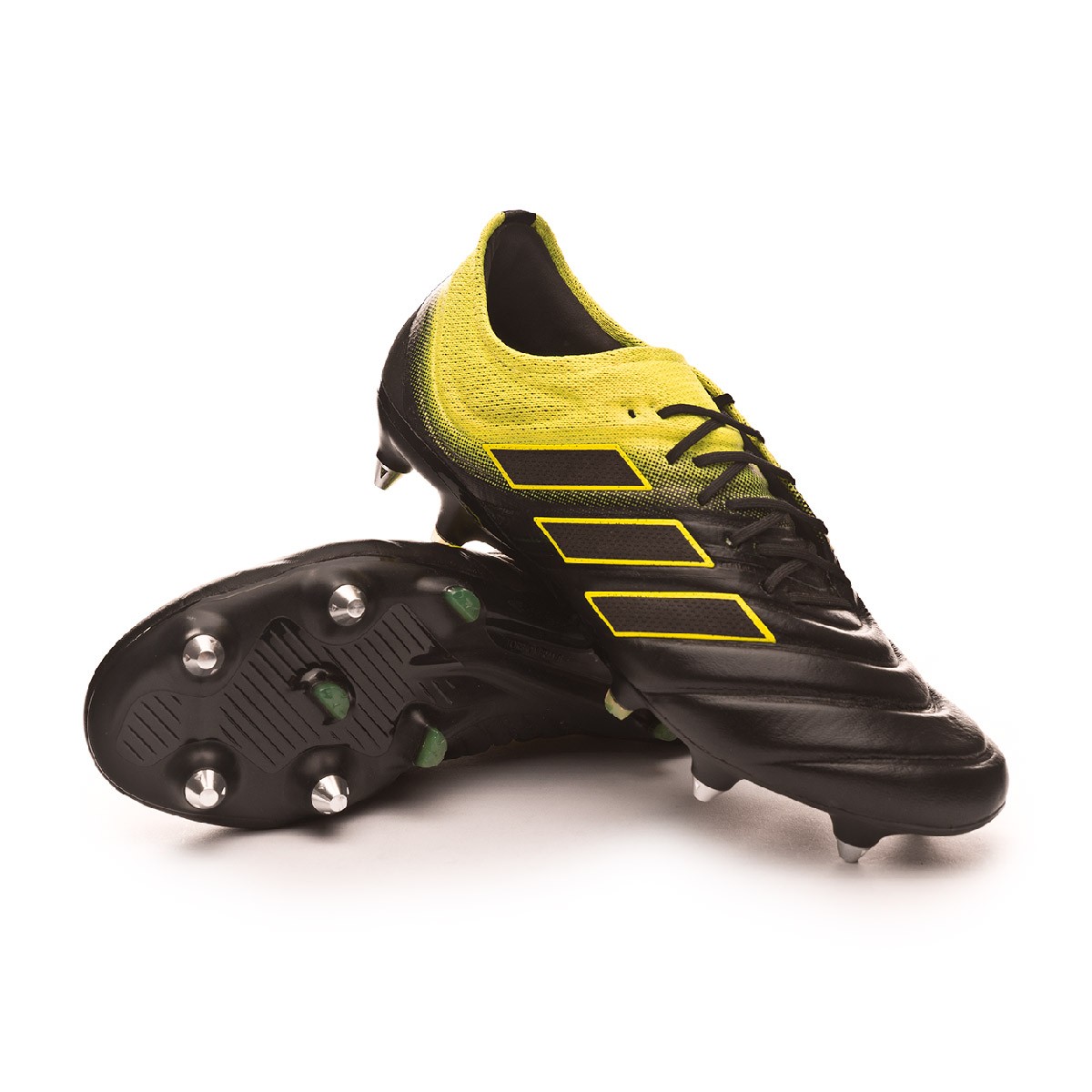 black and yellow adidas football boots