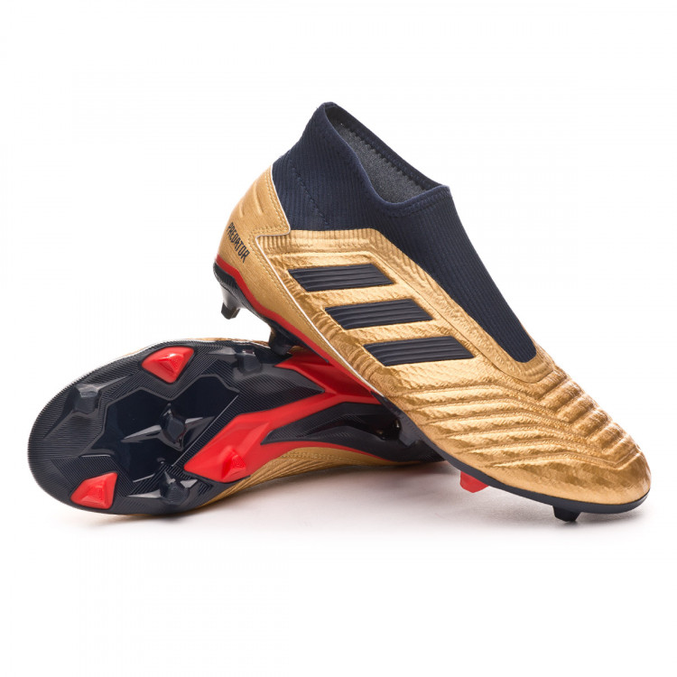 gold laceless football boots