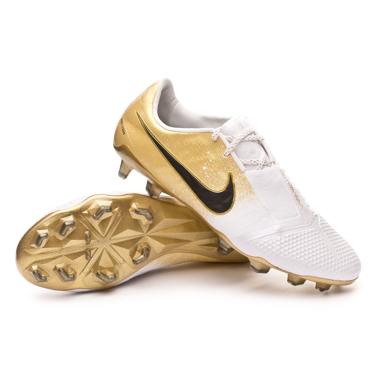 white and gold nike boots