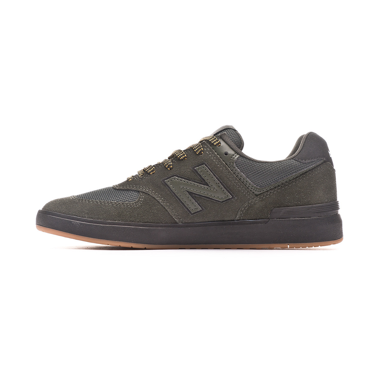 new balance black & green 574 trainers