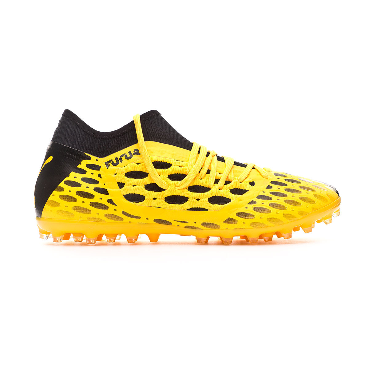 black and yellow puma football boots