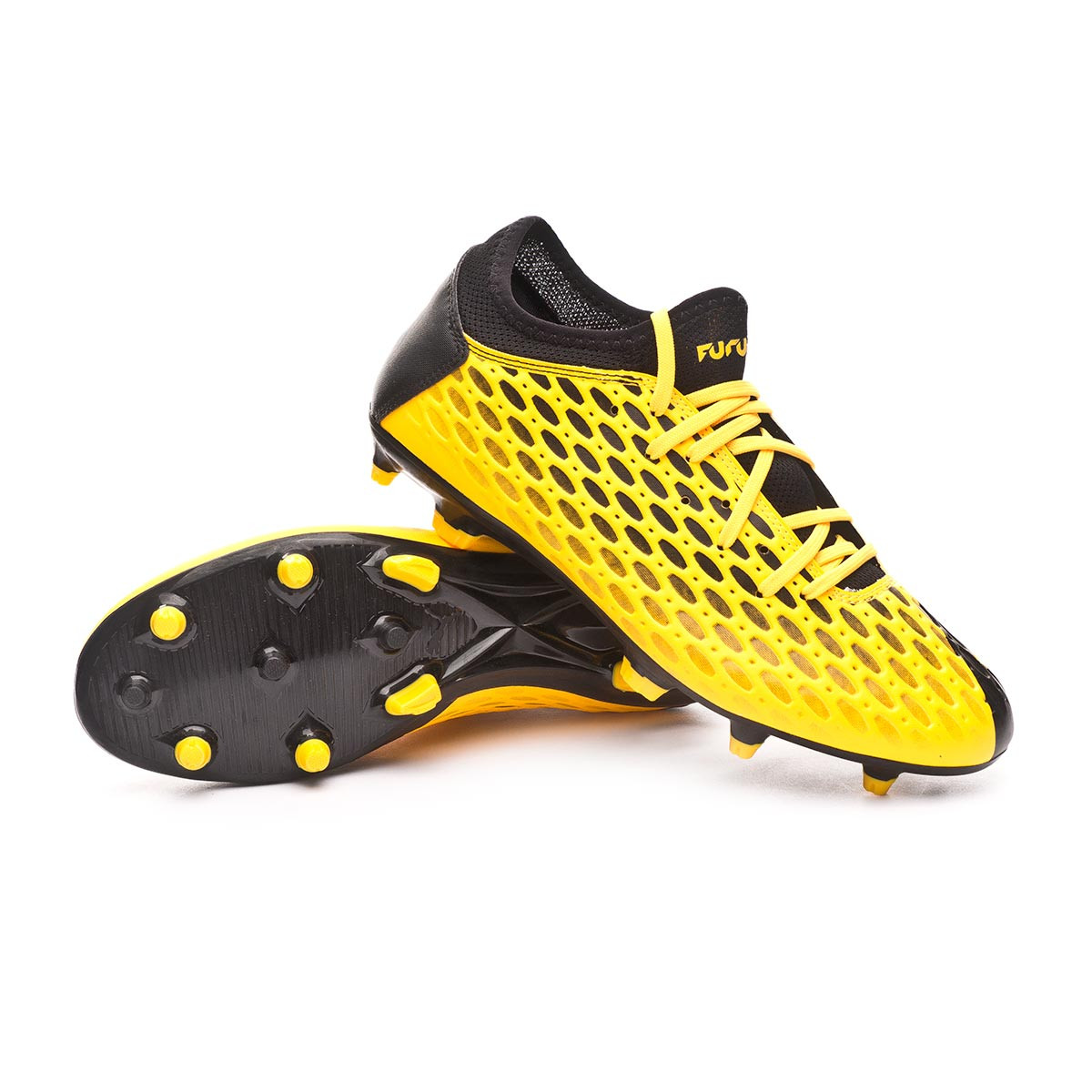 black and yellow puma football boots