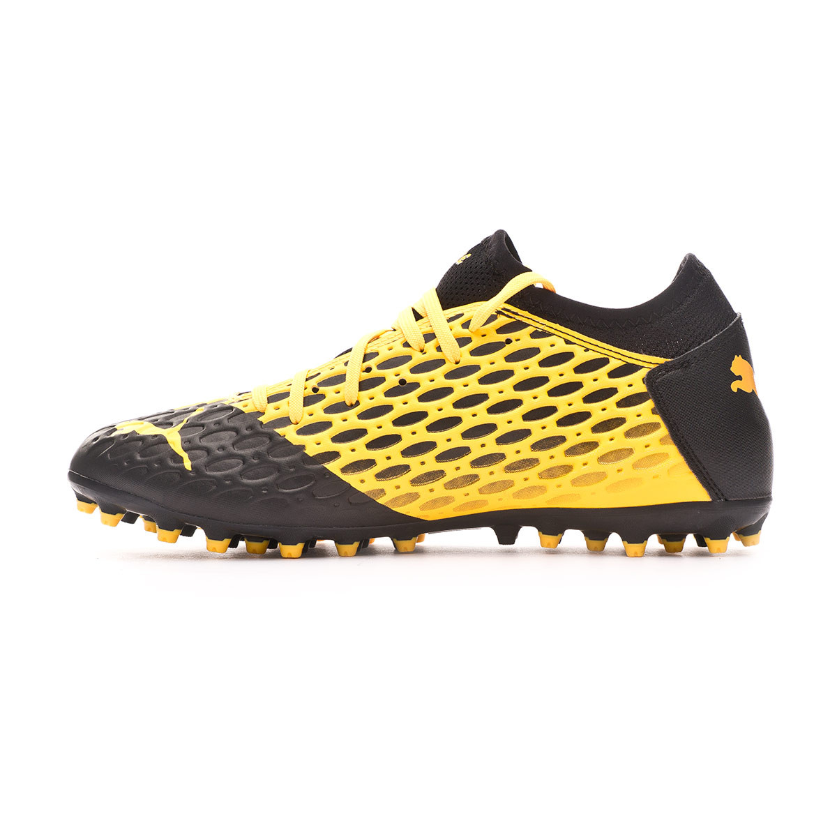 black and yellow puma football boots