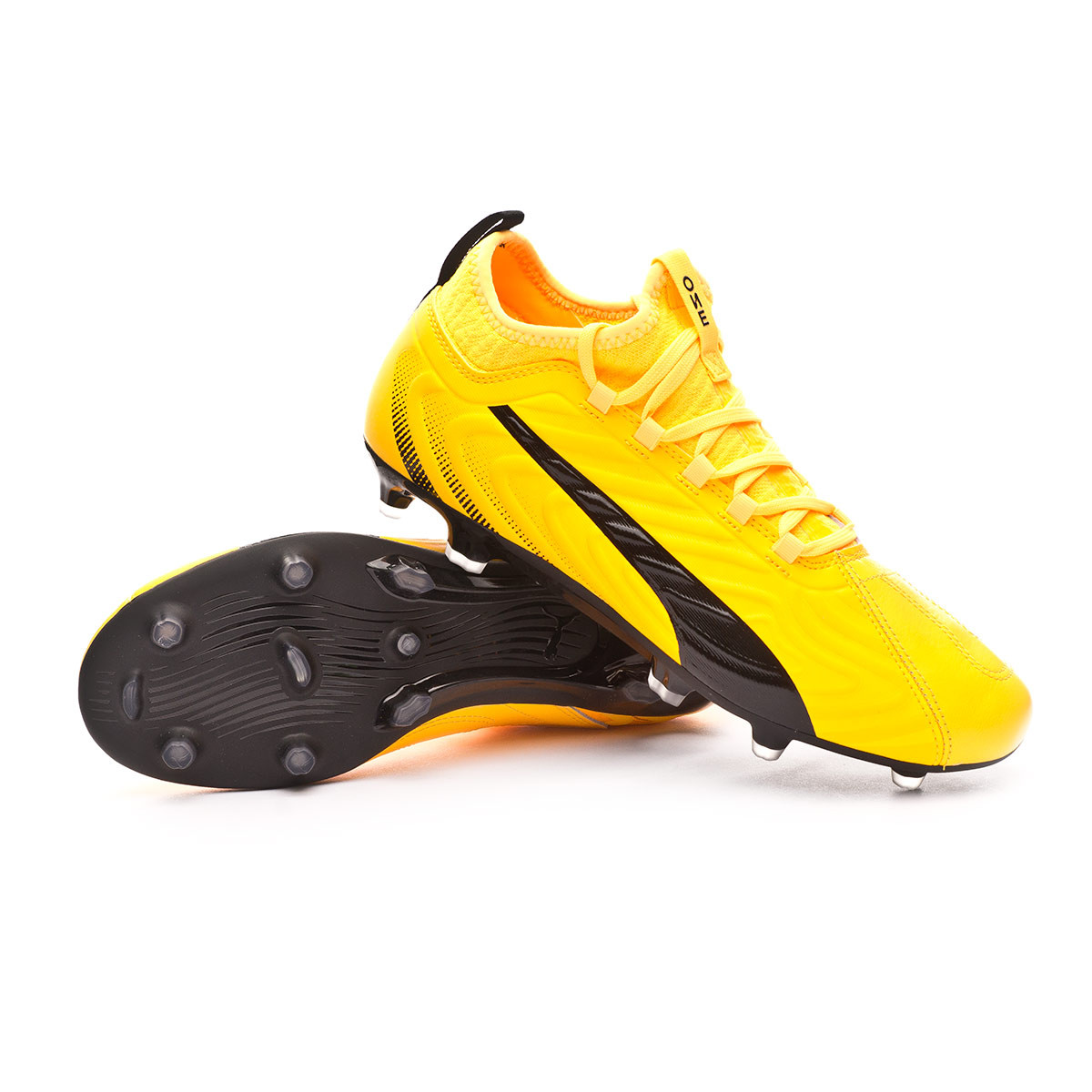 black and yellow puma football boots
