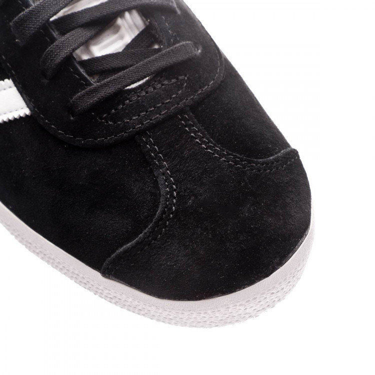 black and white leather gazelles