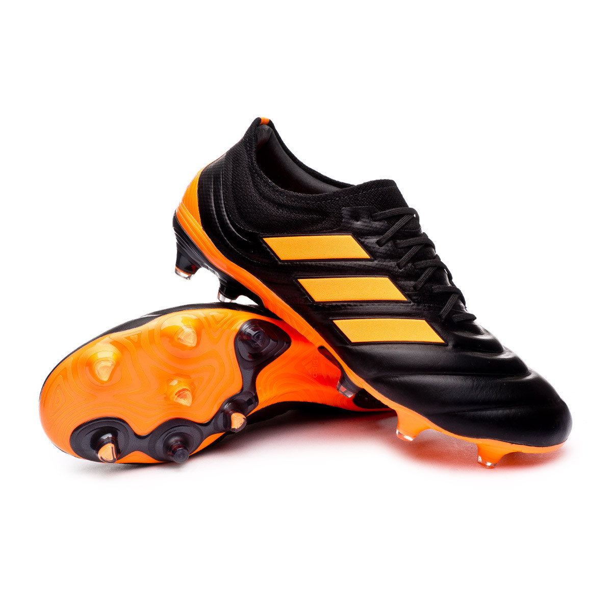 black and orange adidas football boots