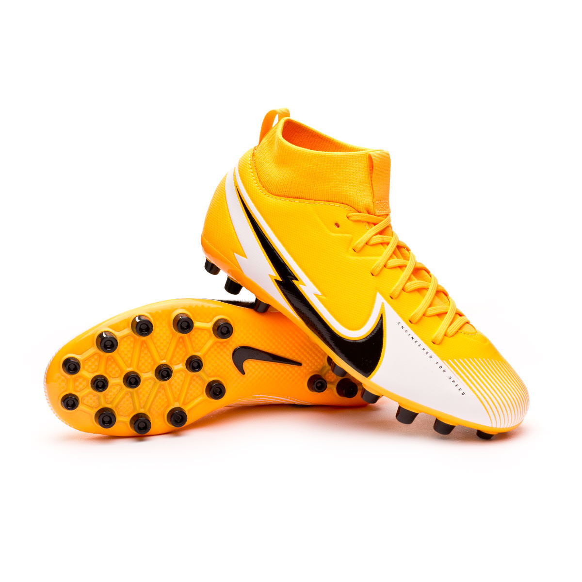 white and orange football boots