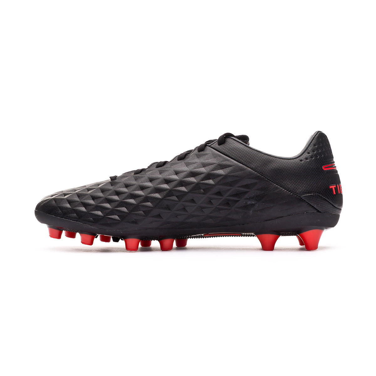 grey and red football boots
