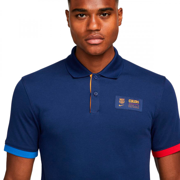 polo-nike-fc-barcelona-fanswear-2021-2022-blue-void-game-royal-vivid-orange-2.jpg