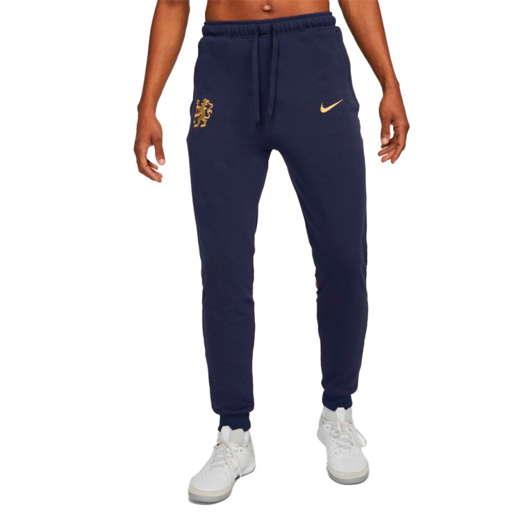 pantalon-largo-nike-chelsea-fc-fanswear-2021-2022-pride-of-london-blackened-blue-jersey-gold-no-sponsor-0.jpg
