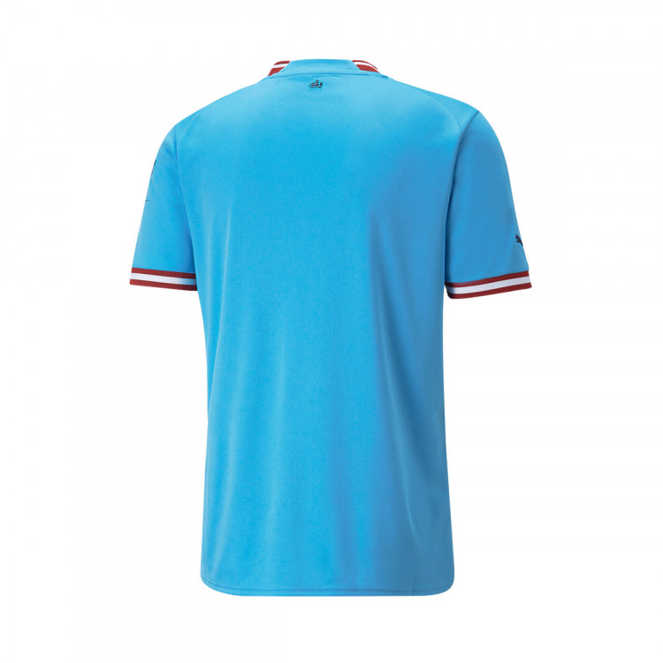 camiseta-puma-manchester-city-fc-primera-equipacion-2022-2023-light-blue-intense-red-1