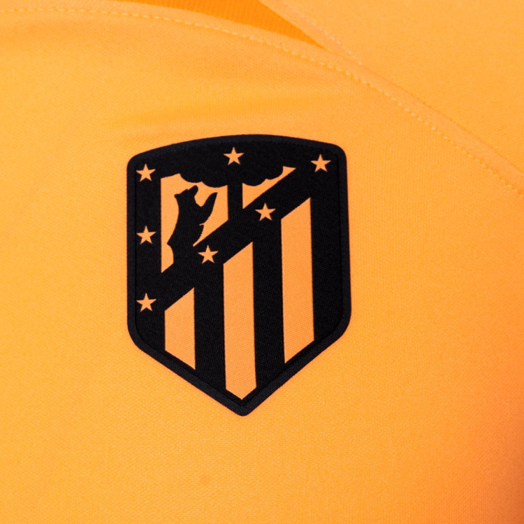 camiseta-nike-atletico-de-madrid-tercera-equipacion-stadium-2022-2023-nino-peach-cream-atomic-orange-laser-crimson-2