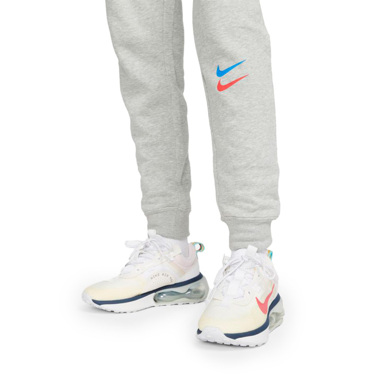 pantalon-largo-nike-fc-barcelona-fanswear-2022-2023-mujer-dark-grey-heather-signal-blue-university-red-3.jpg