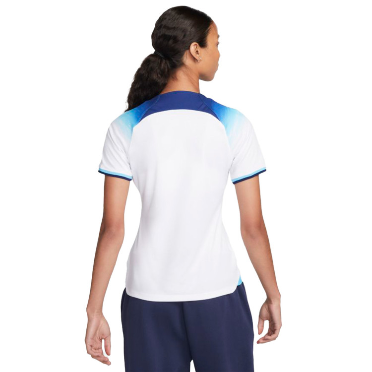 camiseta-nike-inglaterra-primera-equipacion-stadium-mundial-qatar-2022-mujer-white-blue-fury-blue-void-1.jpg