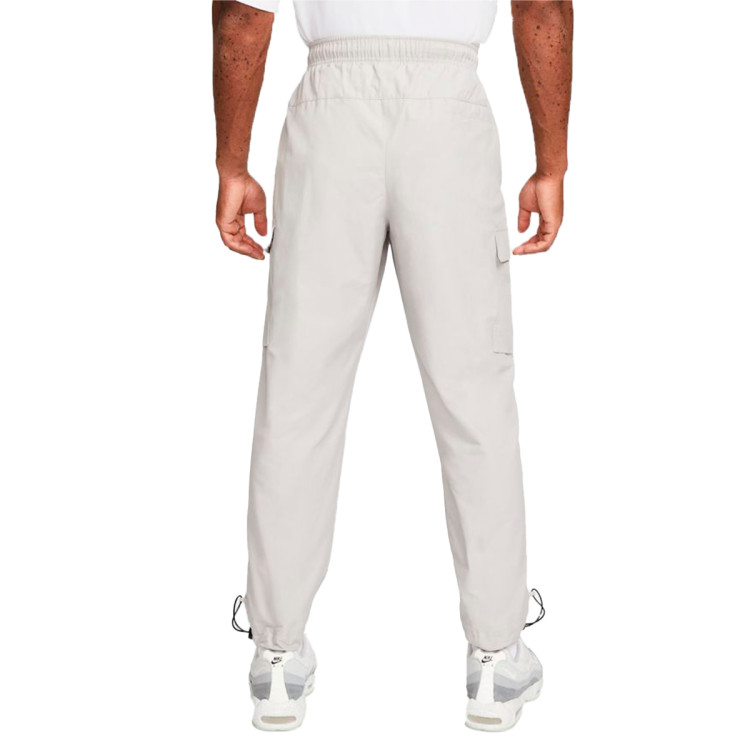 pantalon-largo-nike-sportswear-repeat-swoosh-woven-iron-ore-white-1