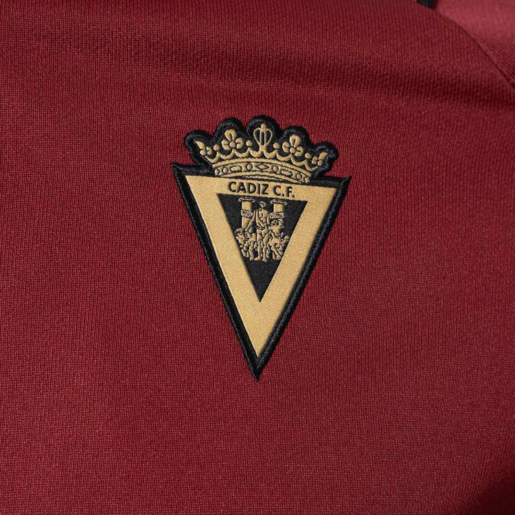chaqueta-macron-cadiz-cf-fanswear-2023-2024-nino-granate-2.jpg