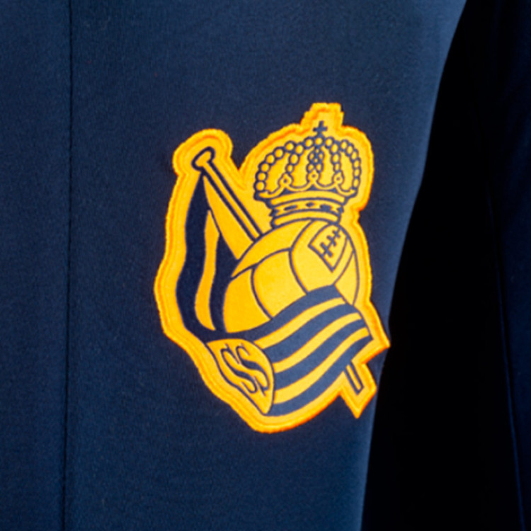 pantalon-largo-macron-real-sociedad-training-2023-2024-nino-azul-marino-1.jpg