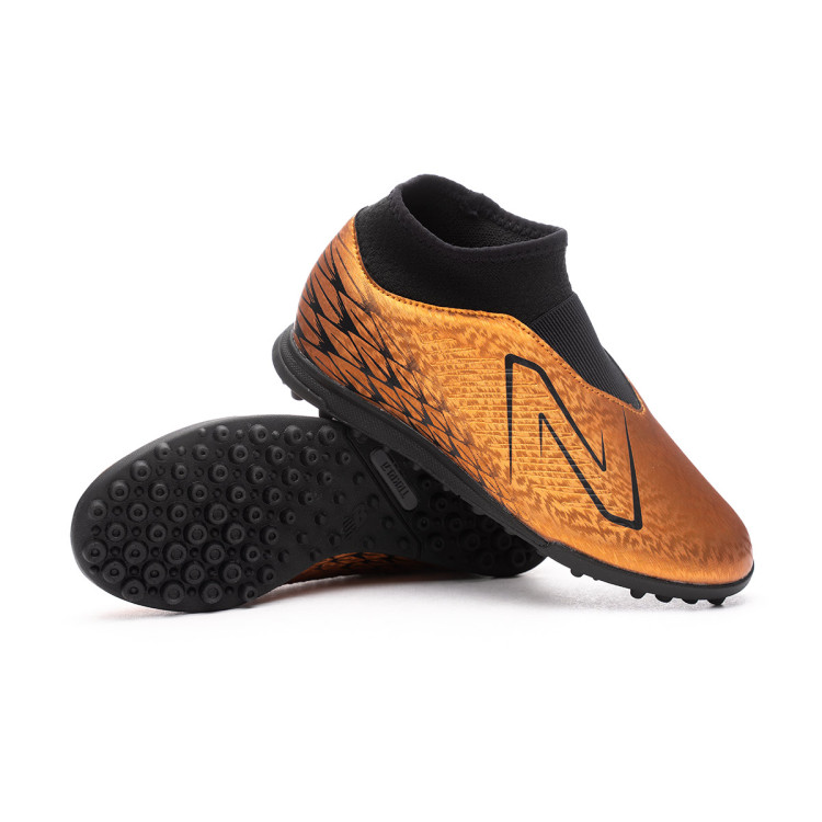 bota-new-balance-tekela-v4-magique-turf-nino-naranja-0