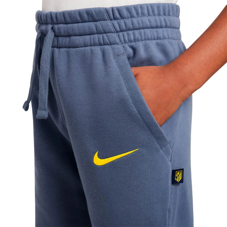 pantalon-largo-nike-atl-madrid-fanswear-2025-2026-nino-diffused-blue-vibrant-yellow-no-sponsor-2