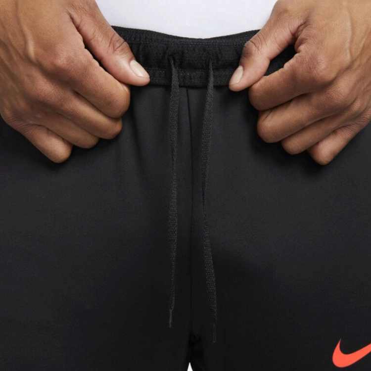 pantalon-largo-nike-pantalon-dri-fit-strike-negro-naranja-7