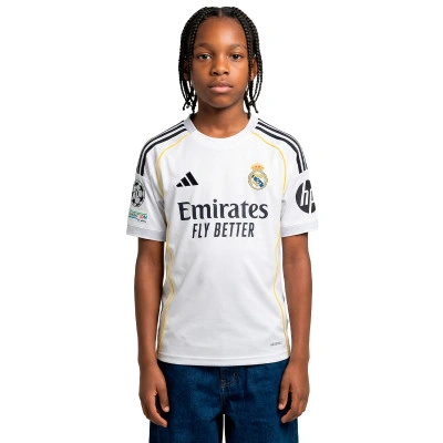 Camisola Real Madrid Primeiro Equipamento 2025-2026 Criança Vini jr + Emblema