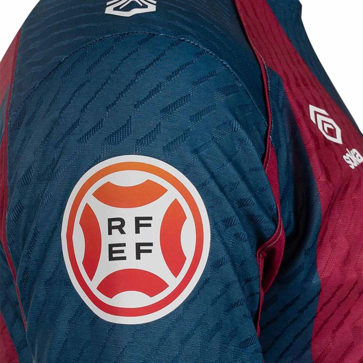 camiseta-soka-sd-huesca-primera-equipacion-nino-2026-2027-sdh-blue-sdh-red-6